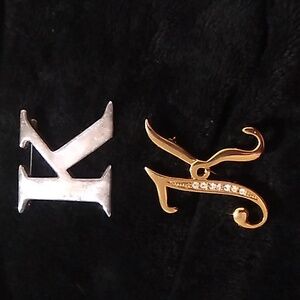 "K" pins/brooches